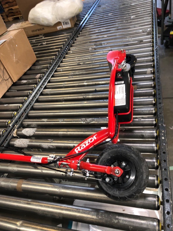 Photo 2 of Razor E100 Electric Scooter for Kids Ages 8+ - 8" Pneumatic Front Tire, Hand-Operated Front Brake, Up to 10 mph and 40 min of Ride Time, For Riders up to 120 lbs
