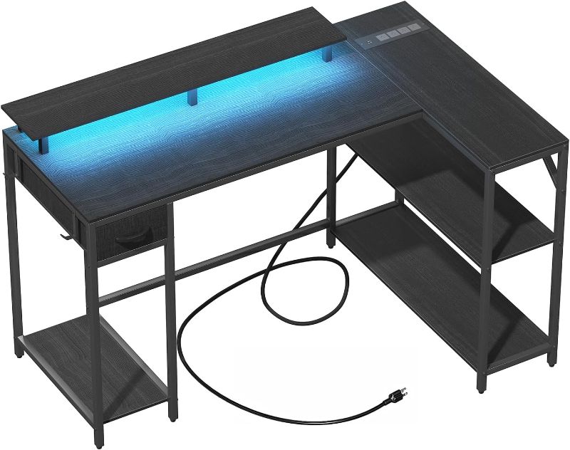 Photo 1 of Eivanet L Shaped Gaming Desk with Power Outlet & LED Light, Corner Gaming Desk with Hook & Monitor Stand, Reversible Computer Office Desk with Drawer and Storage Shelves for Home Office
