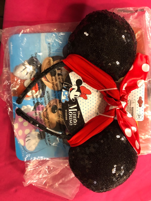 Photo 1 of minnie mouse headband  for girls 
unknown size 
size appears to be 4-5 years 