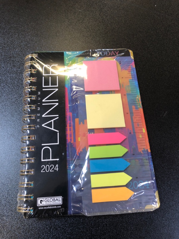 Photo 2 of HARDCOVER 2024 Planner: (November 2023 Through December 2024) 5.5"x8" Daily Weekly Monthly Planner Yearly Agenda. Bookmark, Pocket Folder and Sticky Note Set (Rainbow Cityscape) MEDIUM: 5.5" x 8"