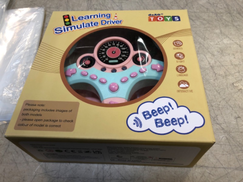 Photo 2 of deAO Kids Steering Wheel for Backseat with Car Key Pretend Driving Simulated Driving Steering Wheel Toy with Light and Music Gifts for Kids Pink