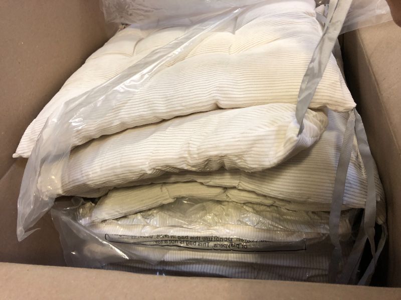 Photo 1 of pack of beige outdoor cushions