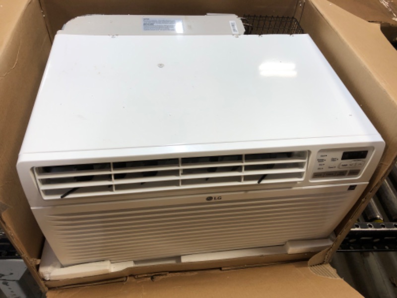Photo 2 of LG 11,800 Wall Air Conditioner with Remote, Cools up to 530 Sq. Ft, Energy Star, 3 Cool & Fan Speeds, Universal Design fits Most Sleeves, 115V, 12000 BTU, White 12000 BTU 115V Cool Only