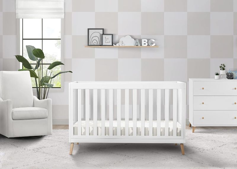 Photo 1 of Delta Children Essex 4-in-1 Convertible Baby Crib, Bianca White with Natural Legs 