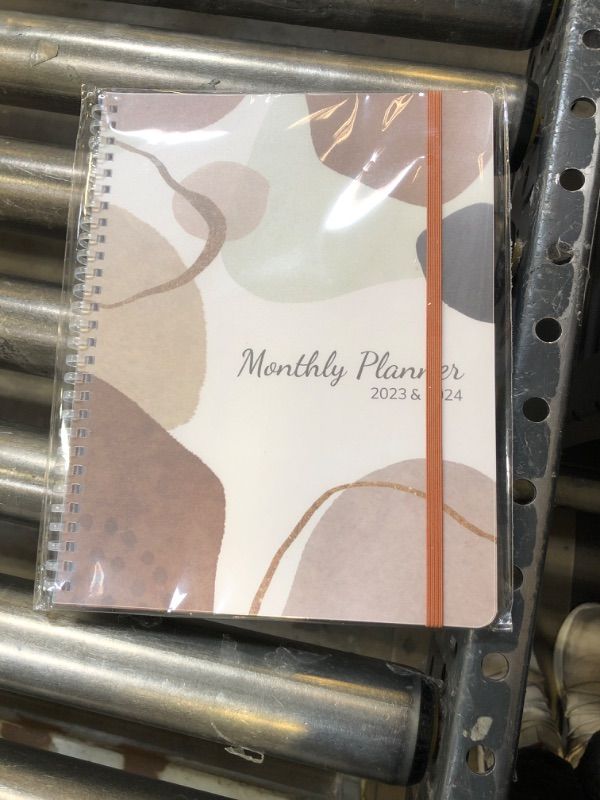 Photo 2 of SKYDUE Monthly Planner 2023-2024, 9.7" x 7.5", 14 Months Calendar Planner from Nov.2023 to Dec.2024, Stylish Soft Spiral Bound, Elastic Closure, Inner Pocket, Waterproof Cover, Thick Paper with More A5 Brown