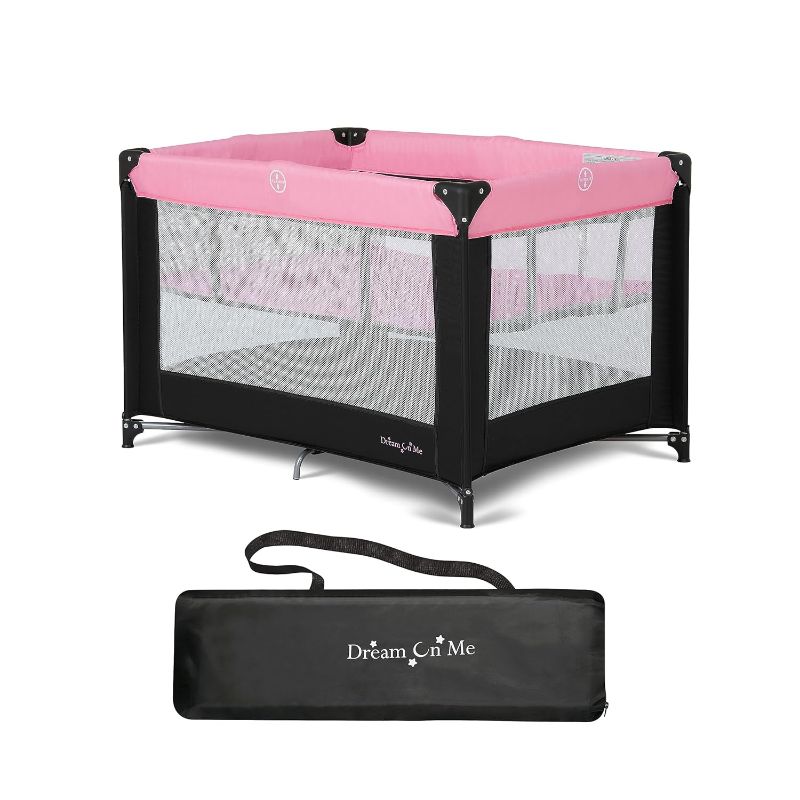 Photo 1 of Dream On Me Zazzy Portable Playard with Bassinet in Pink, with Mattress and Travel Bag, Pink (40 x27.5 x25.5)