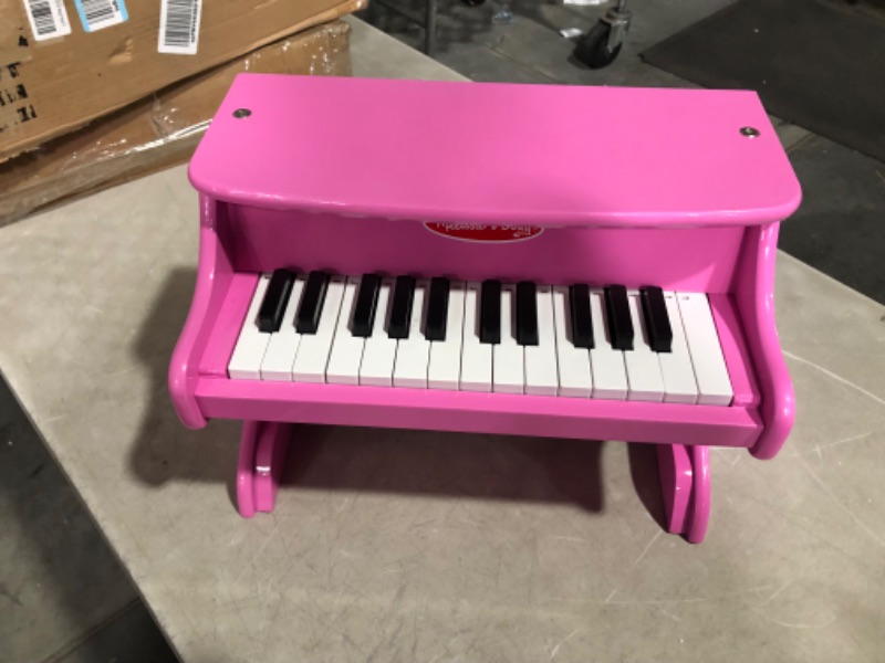 Photo 1 of ***NONREFUNDABLE - MAJOR DAMAGE - NOT FUNCTIONAL - FOR PARTS ONLY - SEE COMMENTS***
Melissa & Doug Learn-to-Play Pink Piano With 25 Keys and Color-Coded Songbook