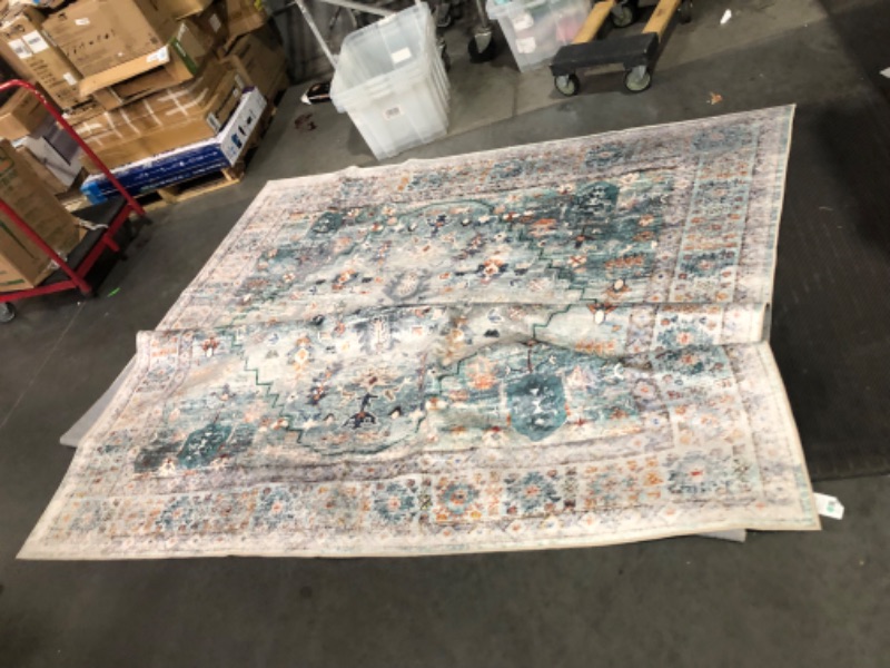 Photo 1 of ***USED - NO PACKAGING***
9 foot by 12 foot Area Rug, Orange/Blue/White Pattern