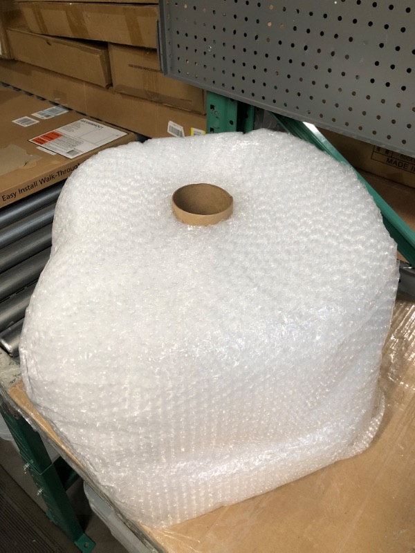 Photo 2 of Amazon Basics Perforated Bubble Cushioning Wrap, Small 3/16", 12-Inch x 175 Foot Long Roll, Clear
