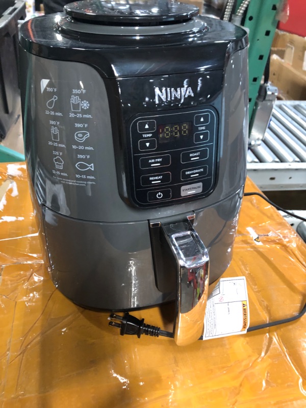 Photo 2 of **powers on and prev used 
Ninja AF101 Air Fryer that Crisps, Roasts, Reheats, & Dehydrates, for Quick, Easy Meals, 4 Quart Capacity, & High Gloss Finish, Black/Grey 4 Quarts