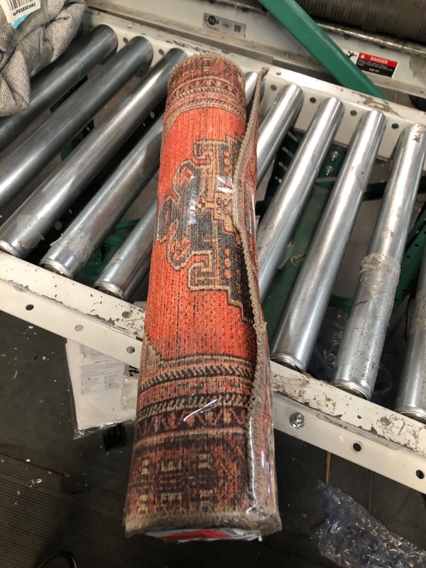 Photo 1 of **GENERAL POST**
2FT 2 INCH X 8 INCH, RUST COLOR  RUG 