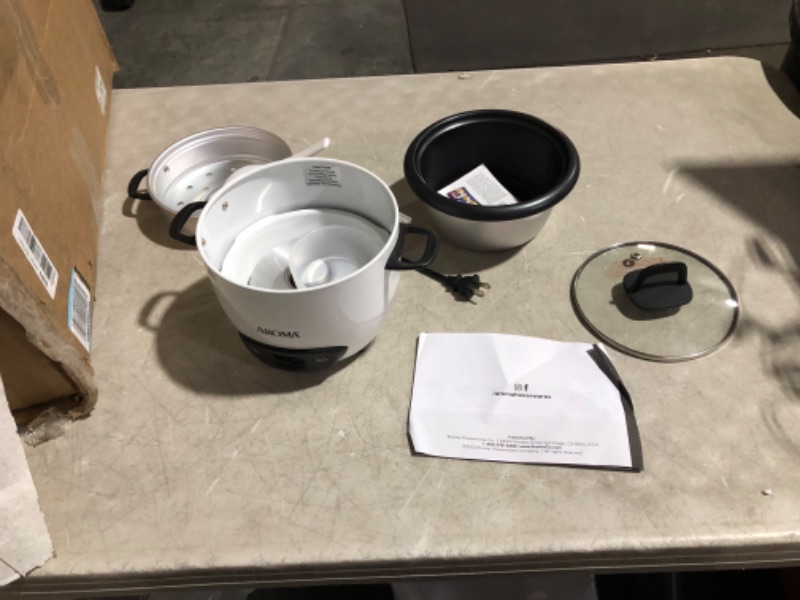 Photo 4 of ***USED - POWERS ON - UNABLE TO TEST FURTHER***
Aroma Housewares 6-Cup (Cooked) (3-Cup Uncooked) Pot Style Rice Cooker and Food Steamer (ARC-743-1NG), White White Steamer, 10.4"D x 11.1"W x 8.1"H