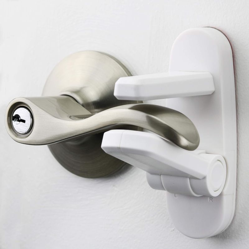 Photo 1 of Door Lever Lock (2 Pack) Prevents Toddlers From Opening Doors. 3.25" L * 1.5" W * 4.5" H Easy One Hand Operation for Adults. Durable ABS with 3M Adhesive Backing. Simple Install, No Tools Needed.
