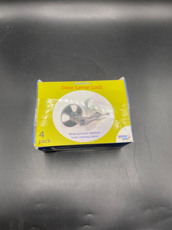 Photo 2 of Door Lever Lock (2 Pack) Prevents Toddlers From Opening Doors. 3.25" L * 1.5" W * 4.5" H Easy One Hand Operation for Adults. Durable ABS with 3M Adhesive Backing. Simple Install, No Tools Needed.
