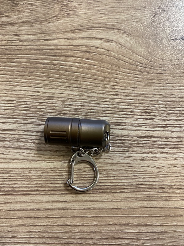 Photo 2 of Tiny Keychain Flashlight, Portable Quick-Release Small Flashlights with Magnetic Base, Powered by 3 LR41 Button Cells for EDC and Emergency