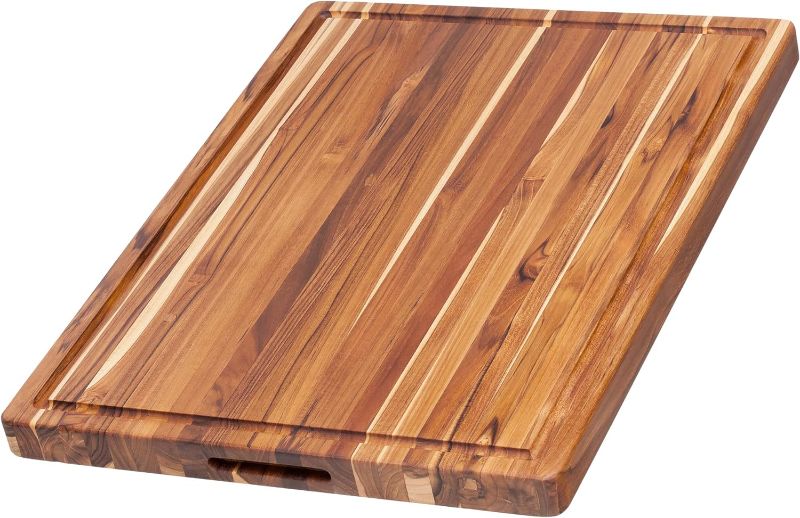 Photo 1 of Teakhaus Carving Board - Large Wood Cutting Board with Juice Groove and Grip Handles - Reversible Teak Edge Grain Wood - Knife Friendly - FSC Certified
