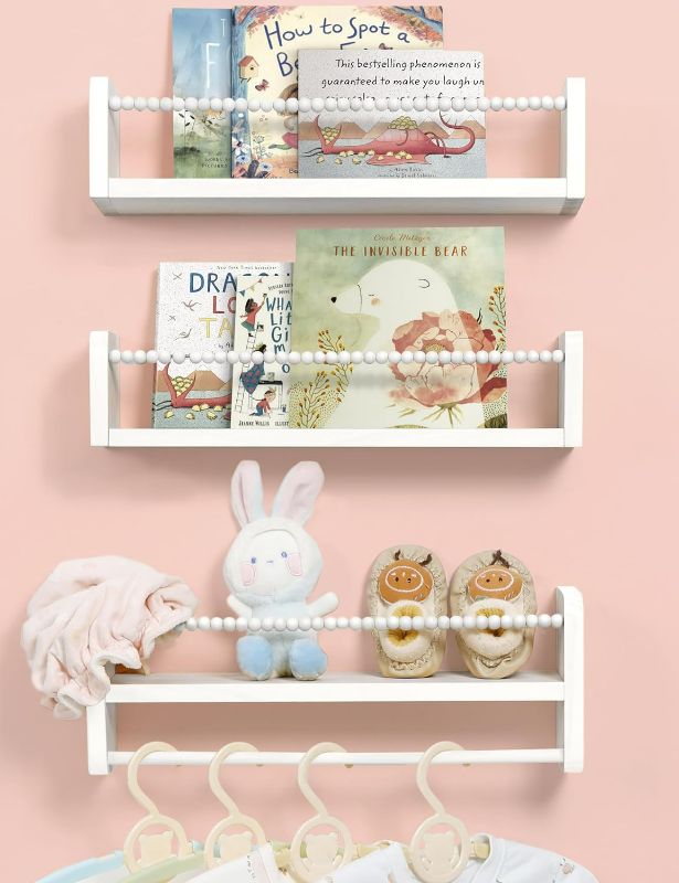 Photo 1 of Nursery Bookshelves Set of 3, Natural Wood Nursery Floating Shelves Wall Mount Storage Shelf with Towel Bar Hainging Bookshelf for Kids Room Bedroom Nursery Decor
