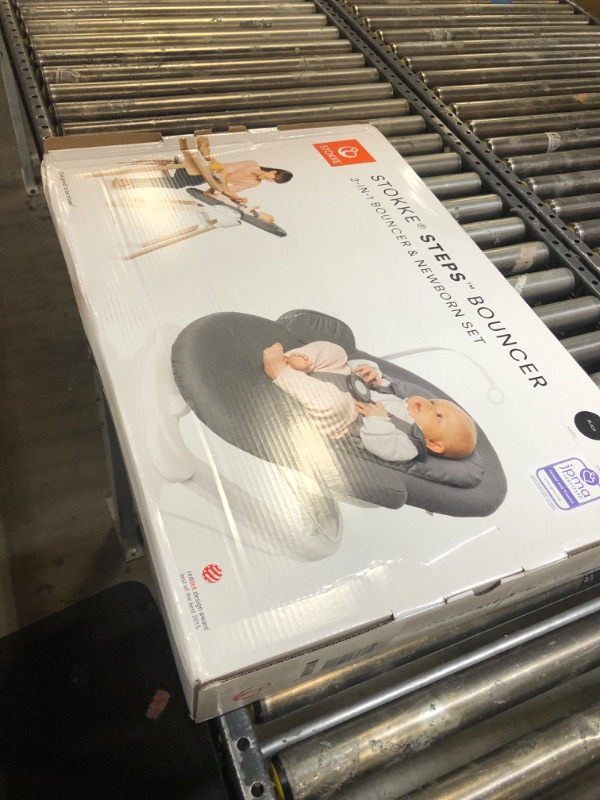 Photo 3 of Stokke Steps Bouncer, Herringbone Grey/White Chassis - Allows Independent Bouncing & Provides Soft Cradling Motion - Use Alone or with Stokke Steps Chair - Certified by JPMA Herringbone Grey / White Chassis