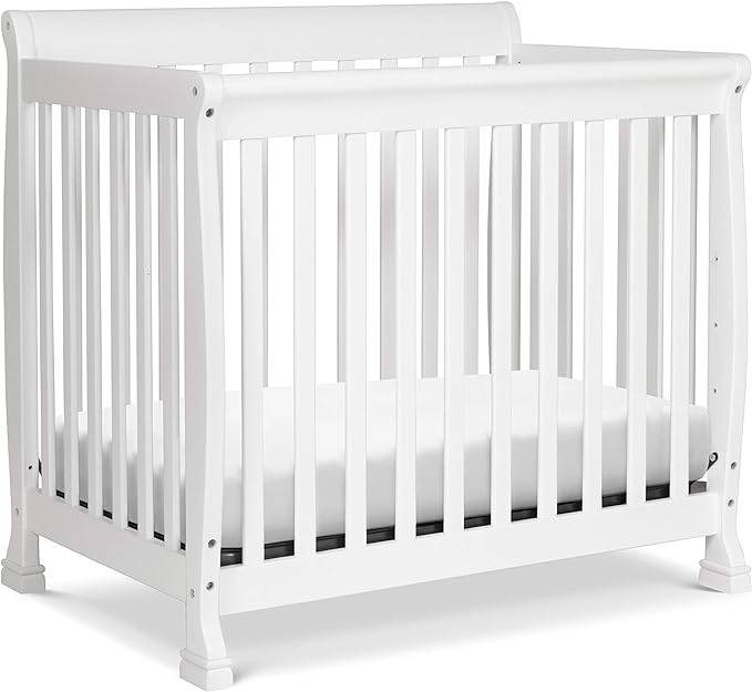Photo 1 of DaVinci Kalani 4-in-1 Convertible Mini Crib in White, Greenguard Gold Certified White 1 Count (Pack of 1) Deluxe