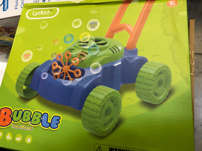 Photo 1 of bubble lawn mower toy 