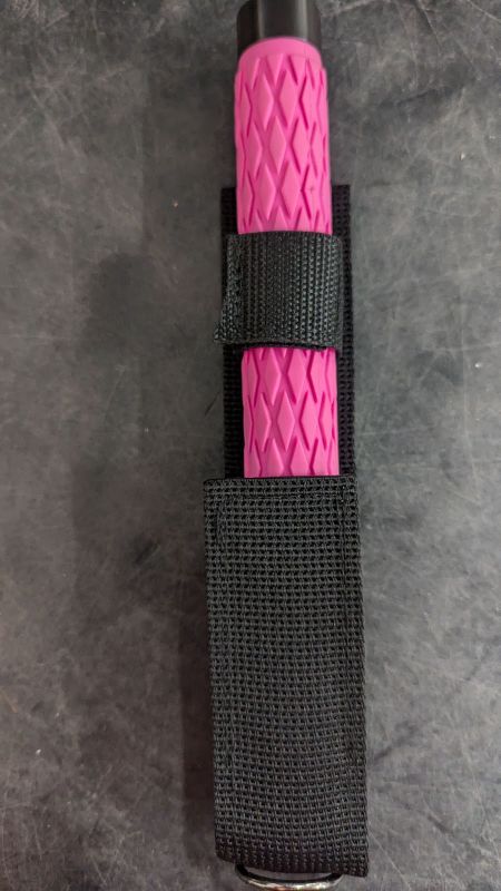 Photo 2 of KWIK FORCE® EXPANDABLE SOLID STEEL TRAINING BATON W/ PINK HANDLE 26'' 