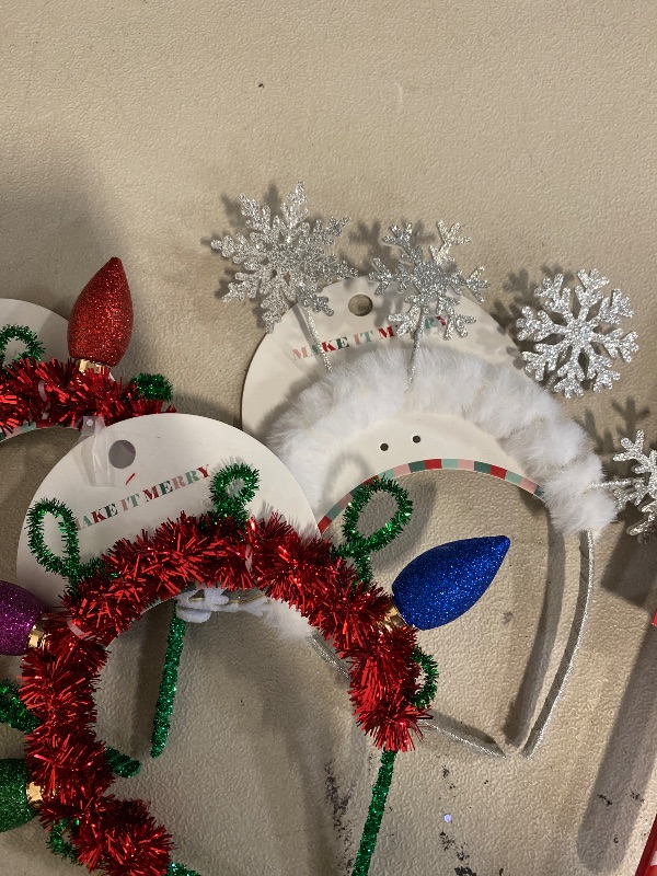 Photo 1 of Christmas themed head bands 2 are damaged 1 still in good condition . 
1 frosting spreader .
