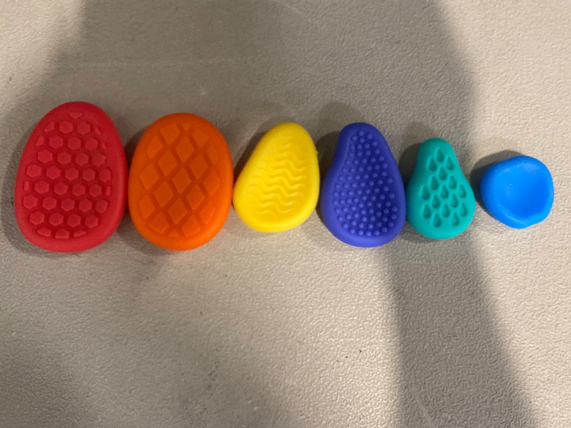 Photo 1 of 6pcs Silicone Sensory Stone Toy Set, Textured Fingertip Toys, Soft Touch Experience, Compact and Noiseless, Ideal for Kids, Vibrant Colors and Fun Patterns