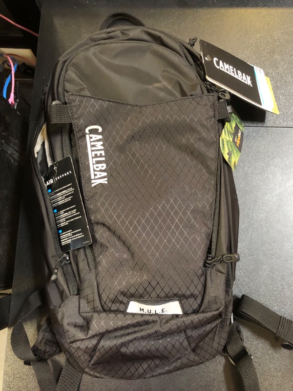 Photo 2 of **MISSING WATER SAC** CamelBak M.U.L.E. 12 Mountain Biking Hydration Backpack - Easy Refilling Hydration Backpack - Magnetic Tube Trap 100oz Black