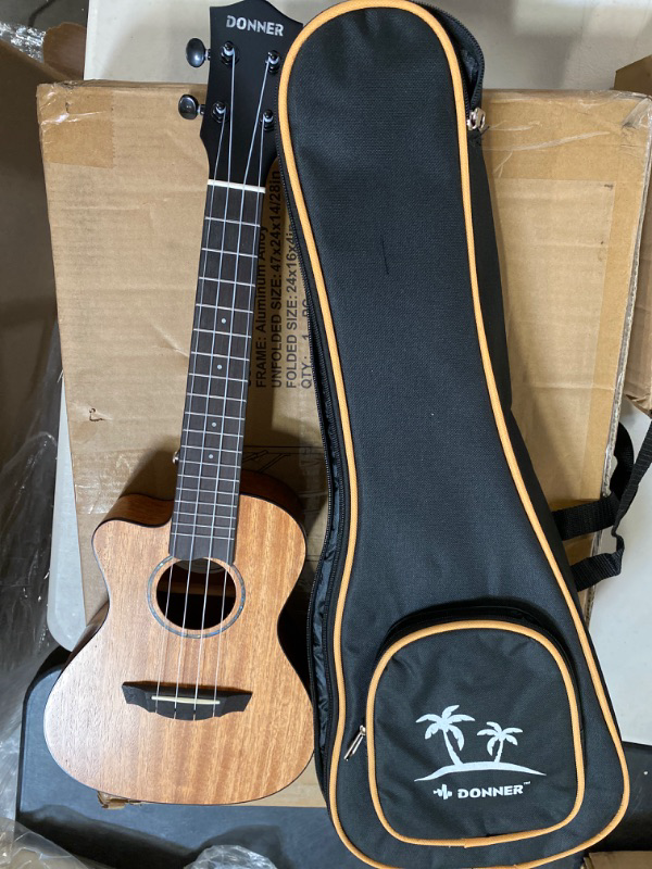 Photo 2 of Donner Concert Ukulele Beginner Mahogany 23 Inch Ukelele Kit with Free Online Lesson Gig Bag Strap Nylon String Tuner Picks Cloth DUC-1 Gift Choice
