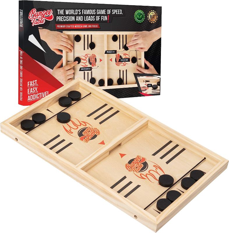 Photo 1 of Large Fast Sling Puck Game - Test Your Speed and Accuracy with This Fast Action Super Winner Wooden Air Hockey Board Game - Guaranteed Fun for Family Game Night or Party with Friends
