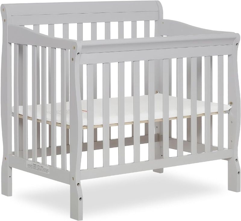 Photo 1 of Aden 4-in-1 Convertible Mini Crib In Grey, Greenguard Gold Certified, Non-Toxic Finish, New Zealand Pinewood, With 3 Mattress Height Settings
