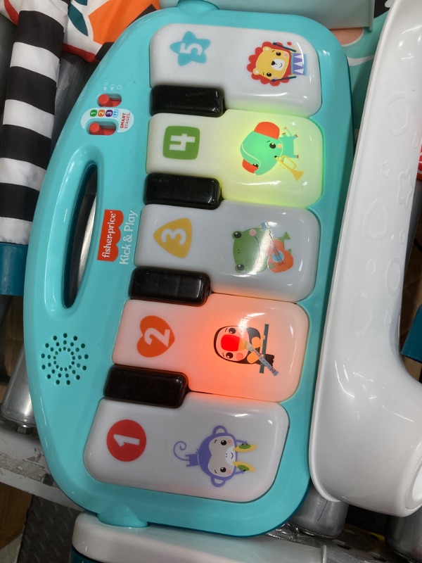 Photo 3 of *** scratches on mirror , needs to be cleaned **Fisher-Price Baby Activity Mat Glow and Grow Kick & Play Piano Gym, Portable Musical Toy with  Smart Stages Learning, Ages 0+ Months, Blue New Blue Kick N Play