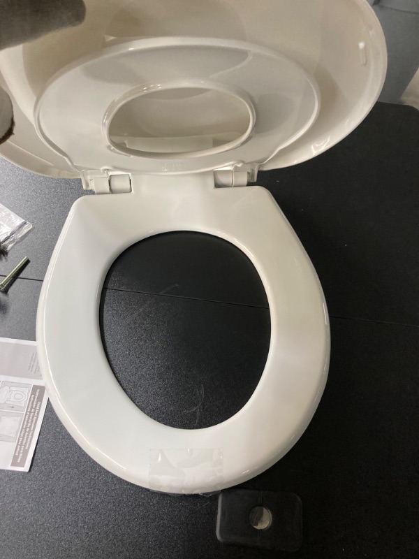 Photo 3 of *MAY BE MISSING PARTS*
Little2Big 81SLOW 000 Toilet Seat with Built-In Potty Training Seat, Slow-Close, and will Never Loosen, ROUND, White 1 Pack Round