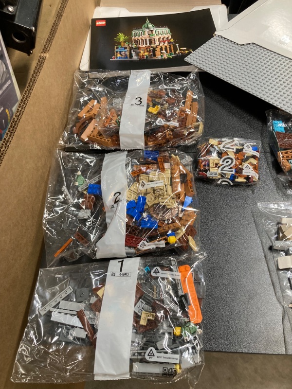 Photo 2 of LEGO Icons Boutique Hotel 10297 Modular Building Display Model Kit for Adults to Build, Set with 5 Detailed Rooms Including Guest Rooms and Gallery Standard Packaging. 
This set is complete with 21  bags numbered 1-14, (multiple bags of some numbers), The