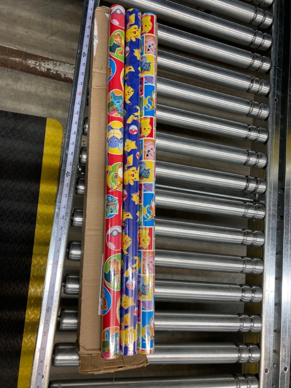 Photo 2 of Hallmark Pokémon Wrapping Paper with Cutlines on Reverse (3 Rolls: 60 Sq. Ft. Ttl) with Pikachu, Charmander, Bulbasaur for Birthdays, Kids Parties, Gamers, Christmas Gifts