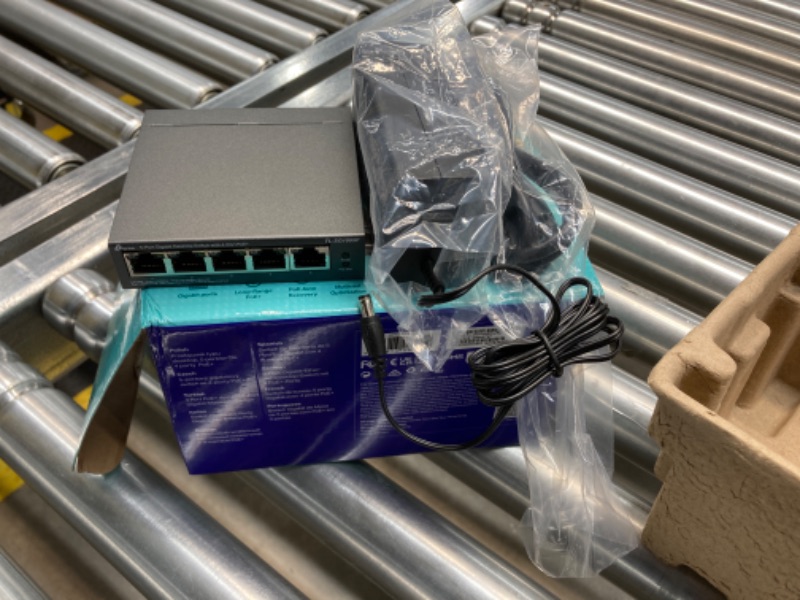 Photo 2 of TP-Link TL-SG1005P, 5 Port Gigabit PoE Switch, 4 PoE+ Ports @65W, Desktop, Plug & Play, Sturdy Metal w/ Shielded Ports, Fanless, QoS & IGMP Snooping,black 5 Port | 4 PoE+, 65W