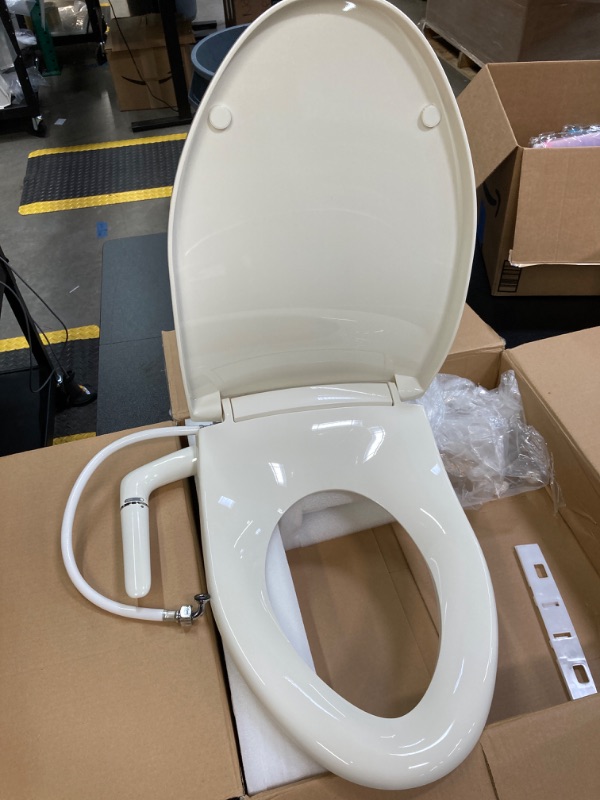 Photo 1 of Kohler K-5724-96 Puretide Elongated Manual Bidet Toilet Seat, White With Quiet-Close Lid And Seat, Adjustable Spray Pressure And Position, Self-Cleaning Wand, No Batteries Or Electrical Outlet Needed Biscuit Elongated Toilet Seat