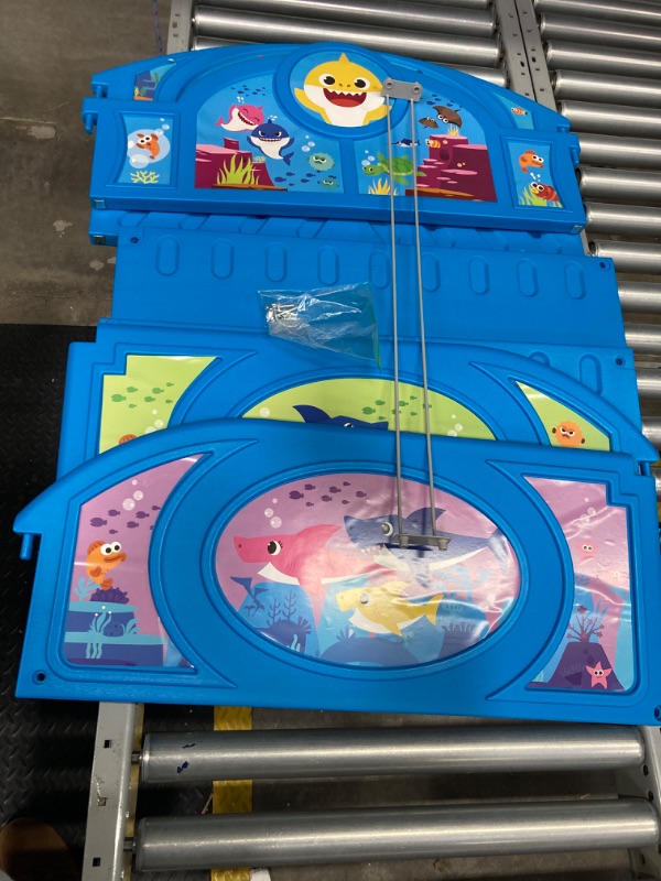 Photo 1 of Baby Shark Plastic Sleep and Play Plastic Toddler Bed with Attached Guardrails by Delta Children, Blue
