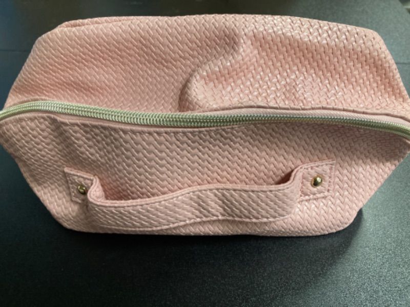 Photo 1 of Pink knit Travel Bag with two makeups