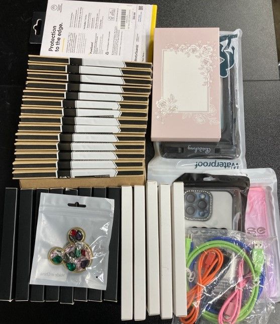 Photo 1 of (IPHONE BUNDLE) Assortment of phone accessories
-Screen Protector
-Camera Protector
-Waterproof bag
 + more