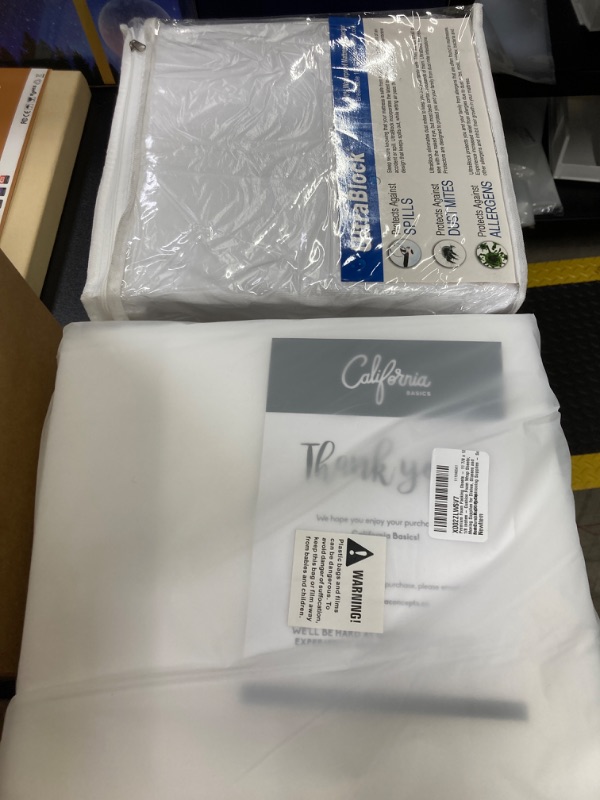 Photo 1 of MISC BUNDLE//FOAM PACKING SHEETS AND MATTRESS PROTECTOR