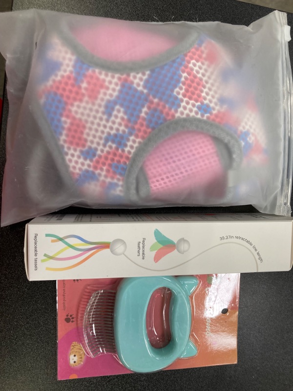 Photo 2 of MISC PET SUPPLY BUNDLE//COMB, TOY AND HARNESS