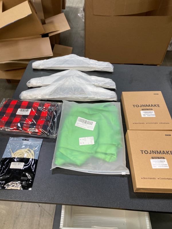 Photo 1 of MISC CLOTHING BUNDLE//HANGERS, FANNY PACKS, SHOELACES AND A SMALL GREEN DRESS