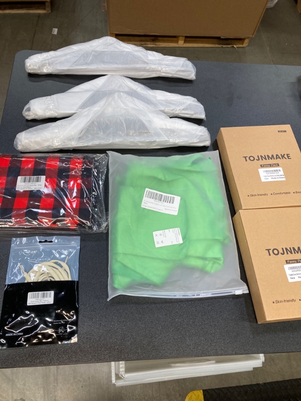 Photo 1 of MISC CLOTHING BUNDLE//HANGERS, FANNY PACKS, SHOELACES AND A SMALL GREEN DRESS