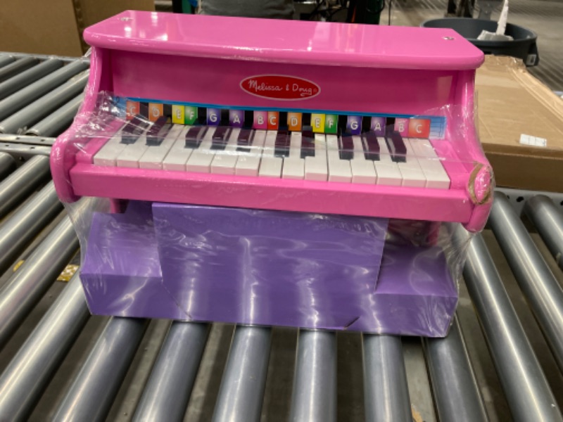 Photo 2 of Melissa & Doug Learn-to-Play Pink Piano With 25 Keys and Color-Coded Songbook