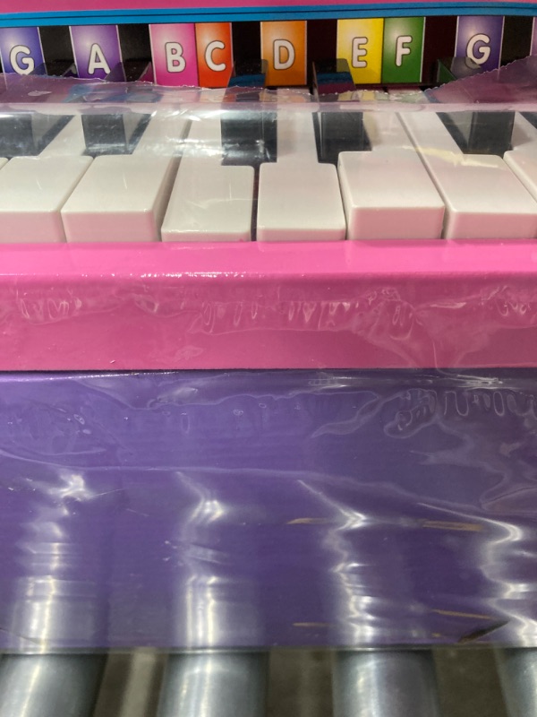 Photo 4 of Melissa & Doug Learn-to-Play Pink Piano With 25 Keys and Color-Coded Songbook