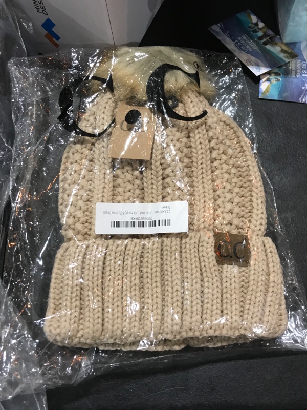 Photo 1 of beige beanie hat 