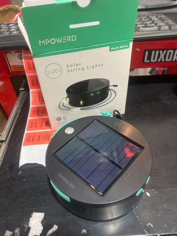 Photo 2 of MPOWERD Luci Solar String Lights + Phone Charger: White 18' Rechargeable via Solar or USB-A, 100 Lumens LEDs, Lasts Up to 20 Hours, Waterproof, Camping, Backyard, and Travel Dark grey, teal Luci String: 18' Warm White + USB-A Charging