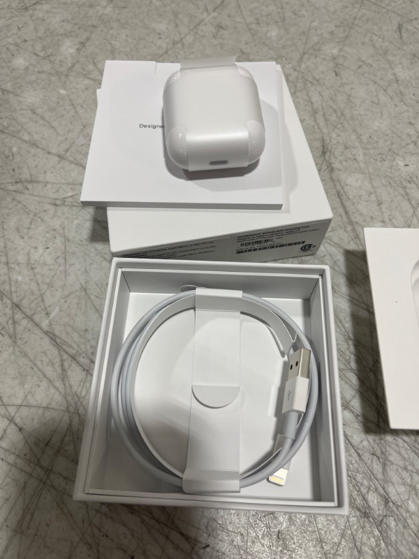 Photo 2 of Apple AirPods (2nd Generation) Wireless Ear Buds, Bluetooth Headphones with Lightning Charging Case Included, Over 24 Hours of Battery Life, Effortless Setup for iPhone - sealed open for photos -+
