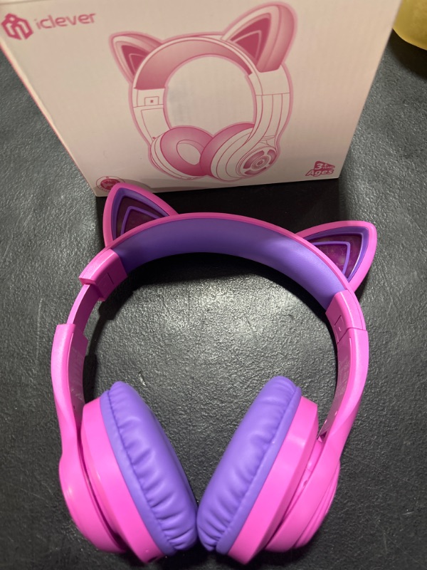 Photo 2 of iClever Cat Ear Kids Bluetooth Headphones, LED Lights Up, 74/85/94dB Volume Limited, 50H Playtime,Bluetooth 5.2, USB C,Kids Headphones Wireless Over Ear for Travel iPad Tablet, Meow Macaron-Hot Pink